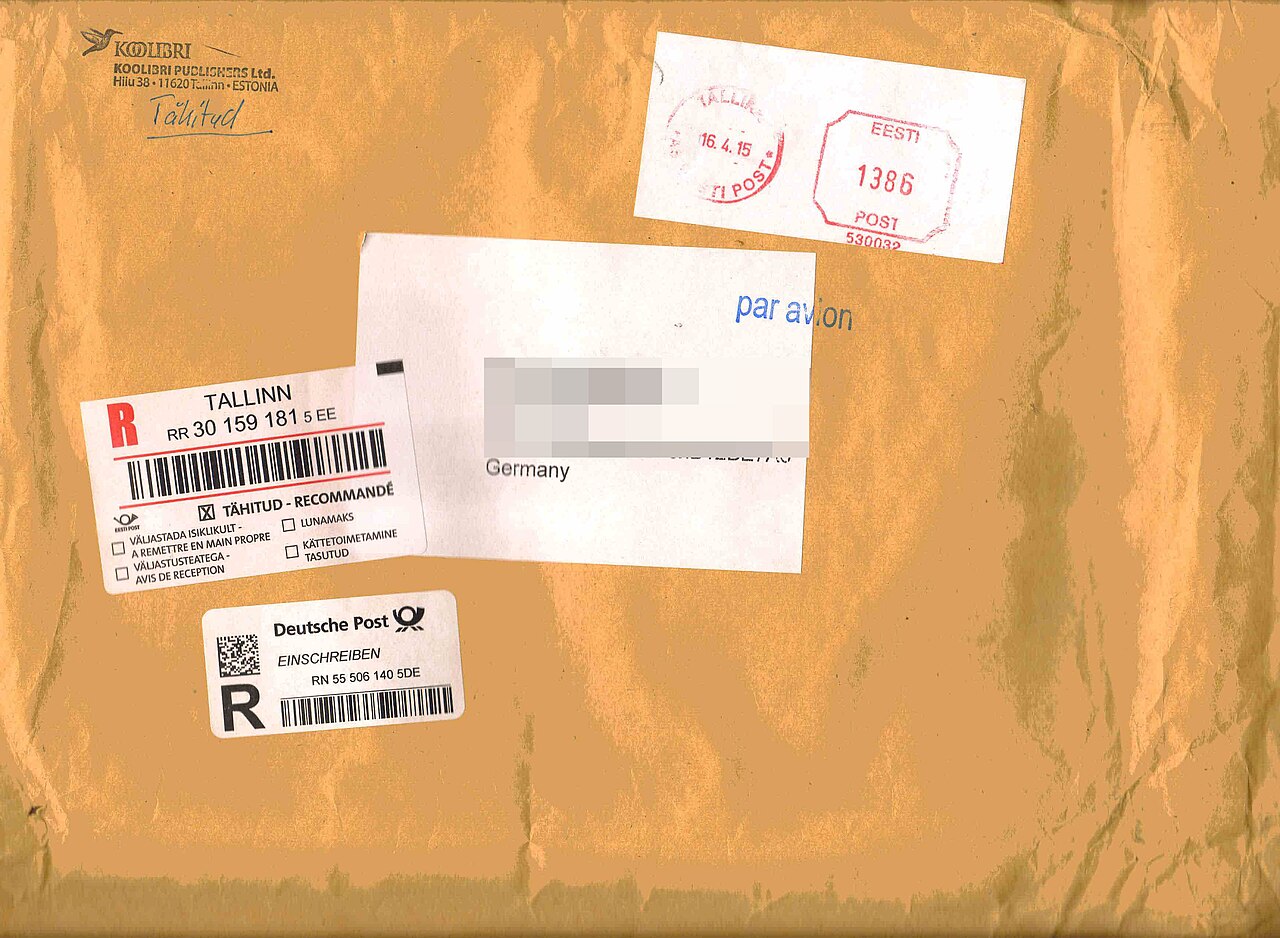 Registered international envelope with postage labels