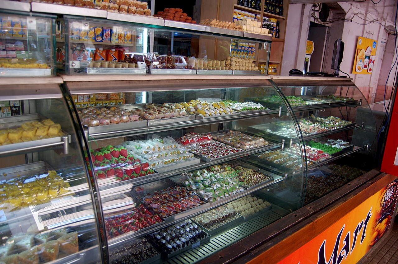 Street-side sweets shop counter in Goa