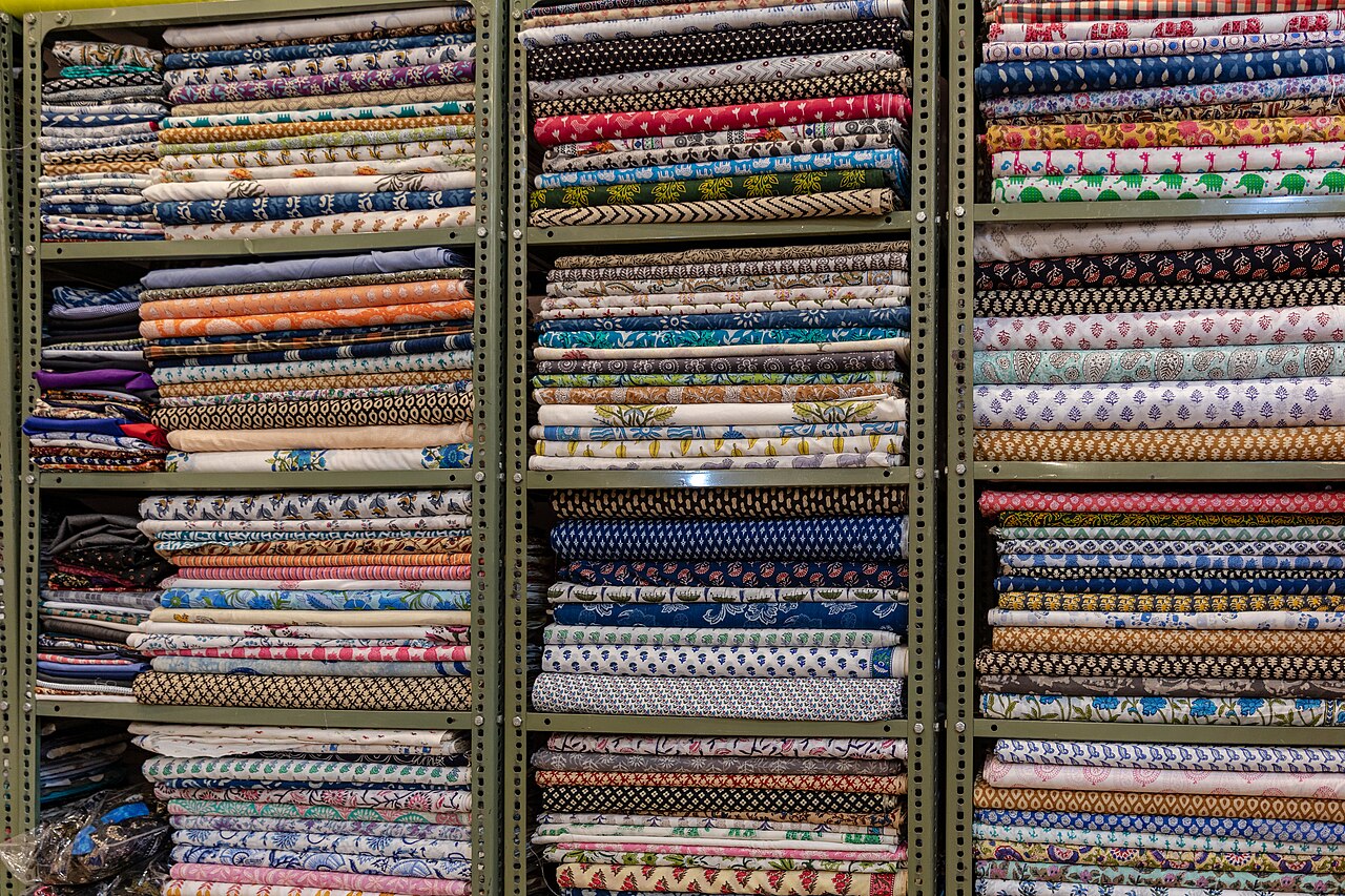 Shelves of folded fabric in a textile shop in Jaipur